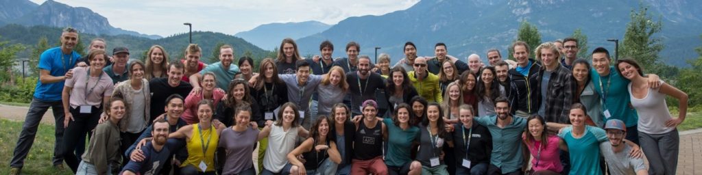 climbing medicine symposium attendees in front of a mountain landscape